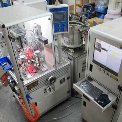 Optical sorting machine with vibratory bowl feeder, enclosed camera station and control cabinet